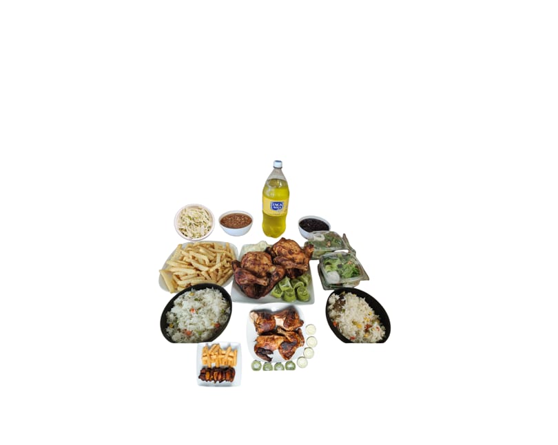 A large family meal with whole roasted chickens, fries, rice, salads, beans, and a bottle of Inca Kola.